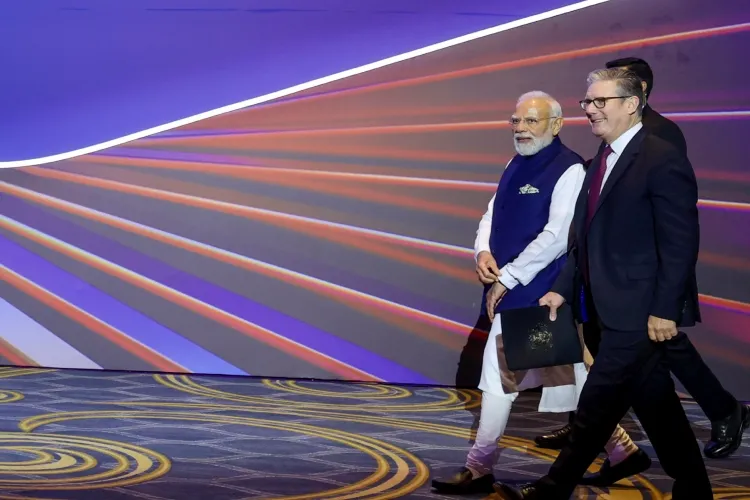 Prime Minister Narendra Modi with his British counterpart Keir Starmer during the Global Fintech Fest 2025, at the Jio World Centre, in Mumbai, Maharashtra.