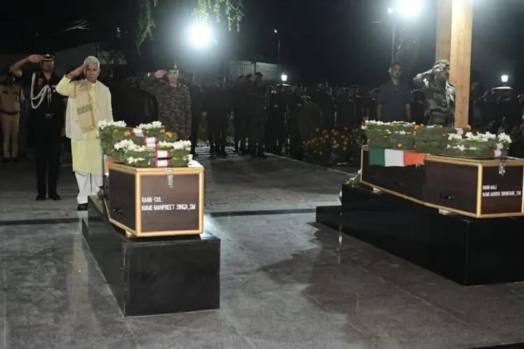 J&K LG Manoj Sinha paying homage to Lance Havildar Palash Ghosh and Lance Naik Sujay Ghosh