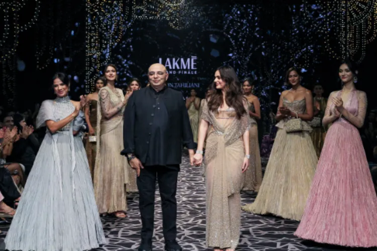 Aneet Padda walks on the ramp with Tarun TIhilani at the lakme Fashion Week