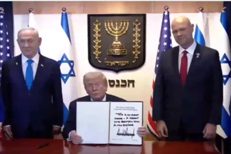US President Donald Trump signing visitors' book in Knesset