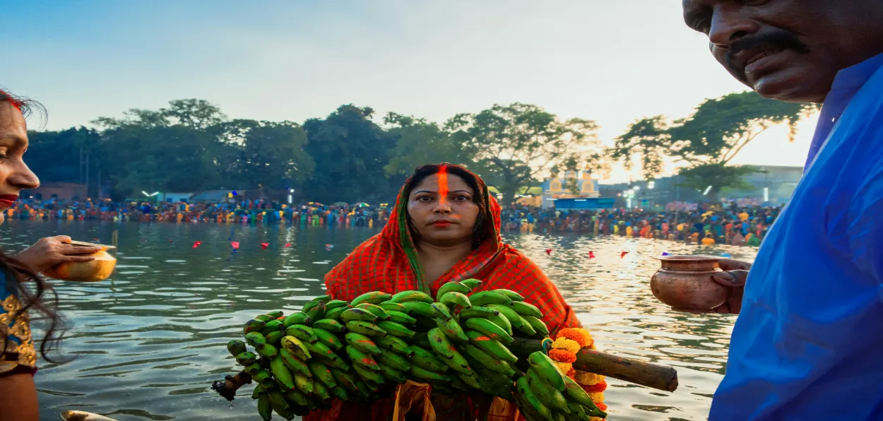 A woman in Patna offers bounties of Nature to the Sun as thanksgiving