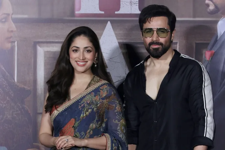 Bollywood actors Yami Gautam Dhar and Emraan Hashmi pose for photographs at the trailer launch of their upcoming film 'Haq'