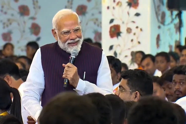 Prime Minister Narendra Modi interacts with a child who has been successfully treated for heart disease at Sri Sathya Sai Sanjeevani Child Heart Hospital during an event, in Nava Raipur Atal Nagar, Chhattisgarh.