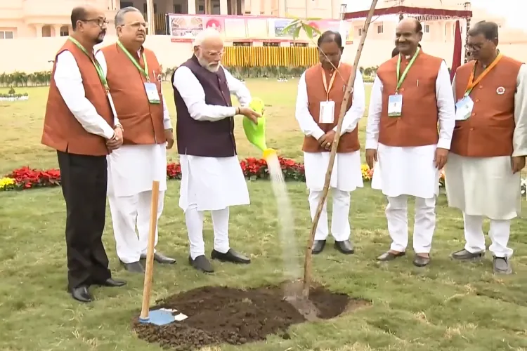 Prime Minister Narendra Modi plants a sapling during inauguration of the new building of Chhattisgarh Legislative Assembly, in Nava Raipur Atal Nagar, Chhattisgarh. Lok Sabha Speaker Om Birla and Chhattisgarh Chief Minister Vishnu Deo Sai are also seen.
