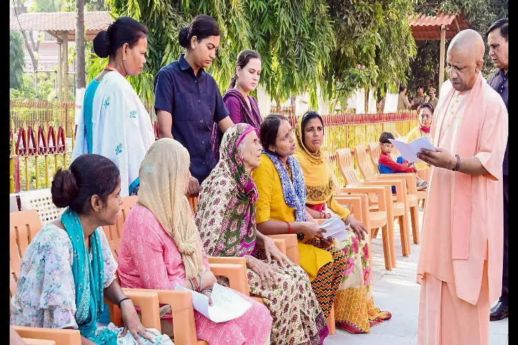Gorakhpur: Uttar Pradesh Chief Minister Yogi Adityanath interacts with people during 'Janta Darshan' at the Gorakhnath Mandir premises, in Gorakhpur