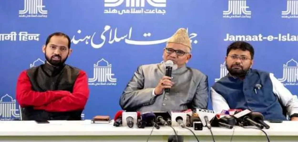 Prof. Salim Enginee (center) speaking to the media