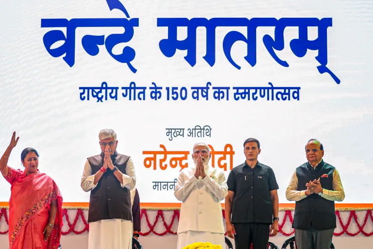 PM Modi (C), Delhi Lt. Governor VK Saxena (R) CM Rekha Gupta (L) Minister of Culture and Tourism Gajendra Singh Shekhawat during an event marking 150 years of the national song Vande Mataram