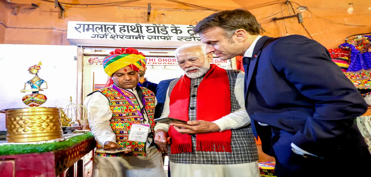 Prime Minister Narendra Modi using UPI as French President Emanual Macron looks on
