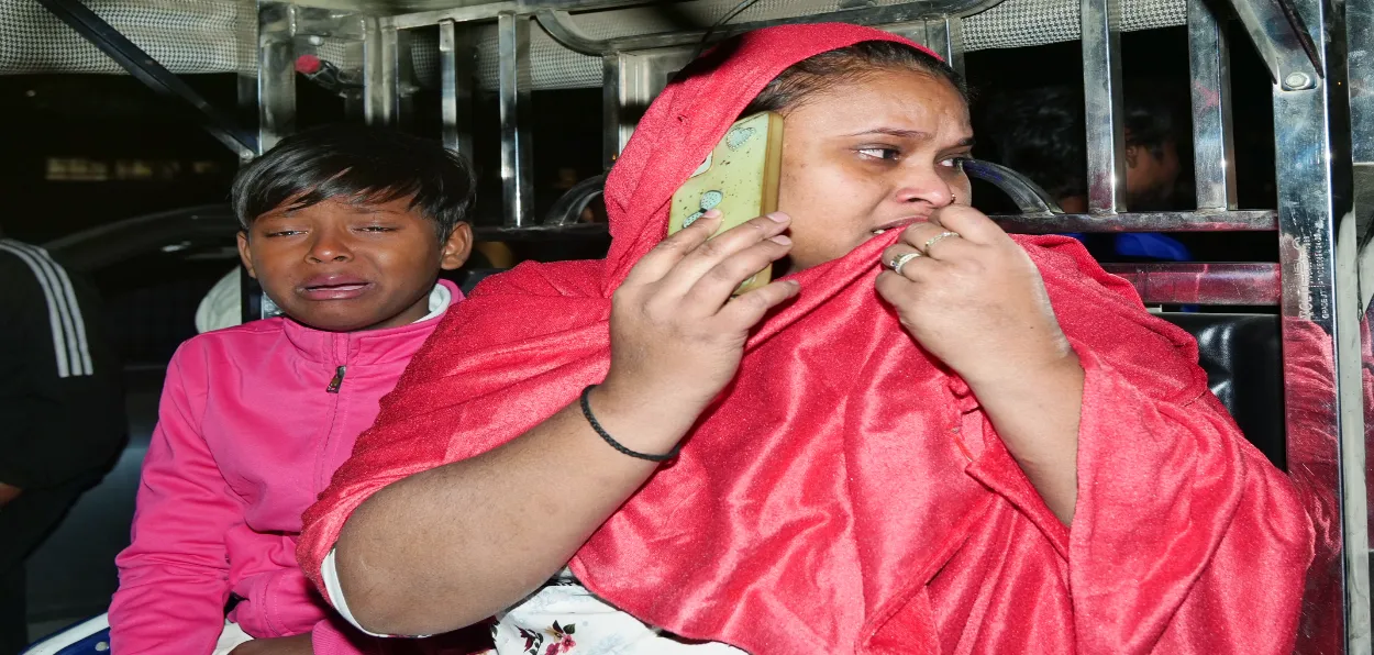 A woman with her child looking desperately for her husband who was around the blast site at the time of explosion