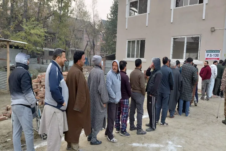 Long line of voters outside a polling booth in Budgam
