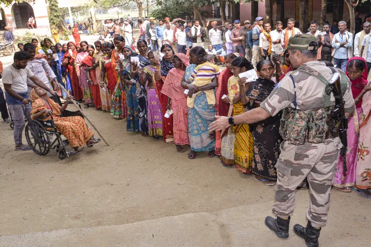 A security personnel keeps vigil at a polling station during the second and final phase of the Bihar Assembly elections, in Jehanabad