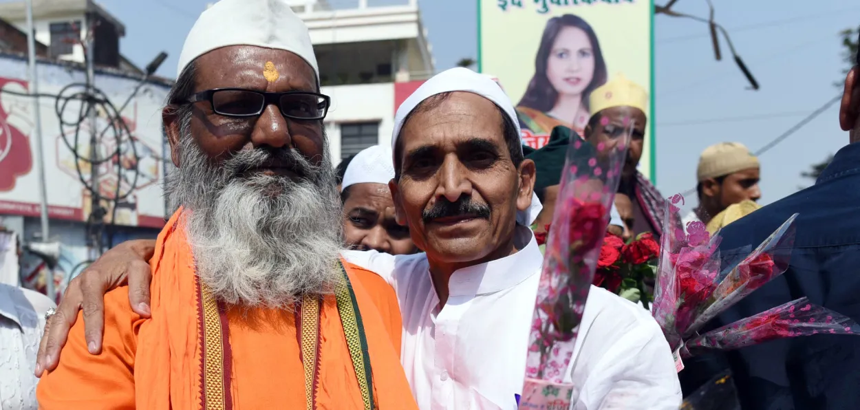 A Hindu and a Muslim exchanging greeting on Eid ul Fitr festival in Prayagraj, UP