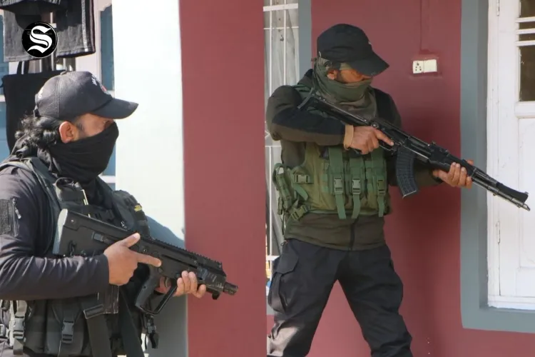 Police raiding house of a Jamaat-e-Islami member