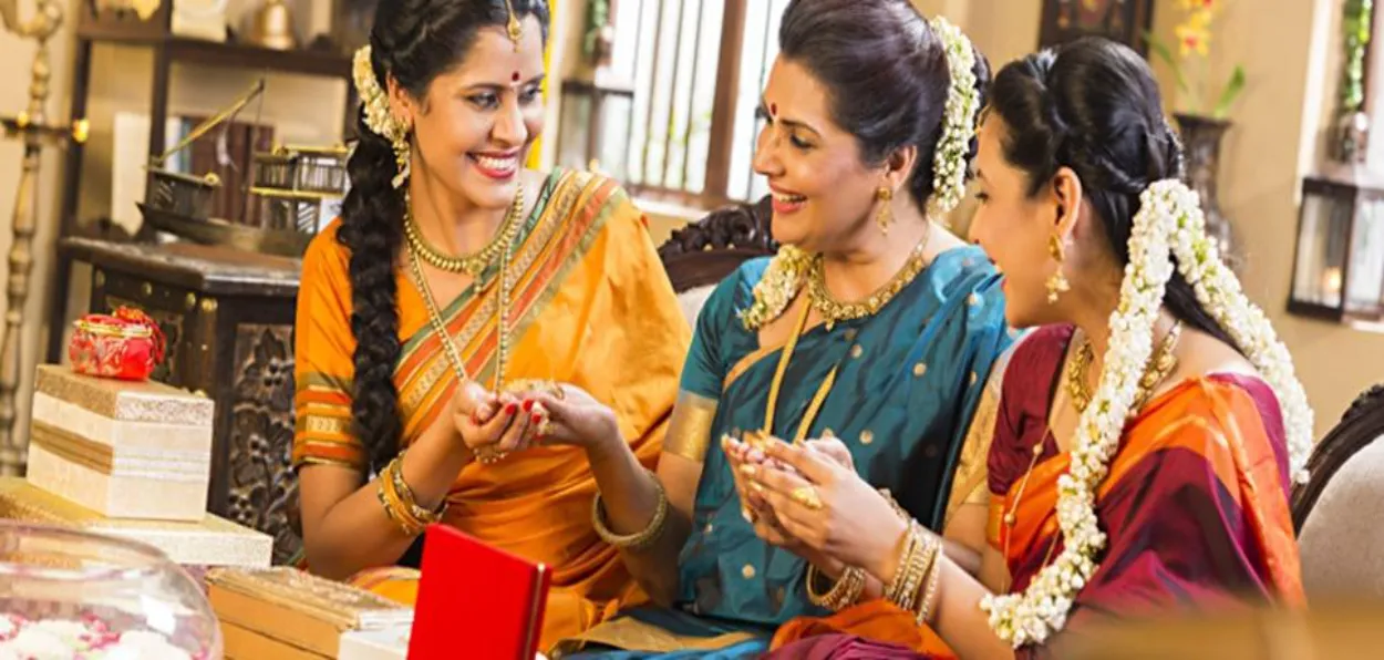 Indian women buying gold ornaments 