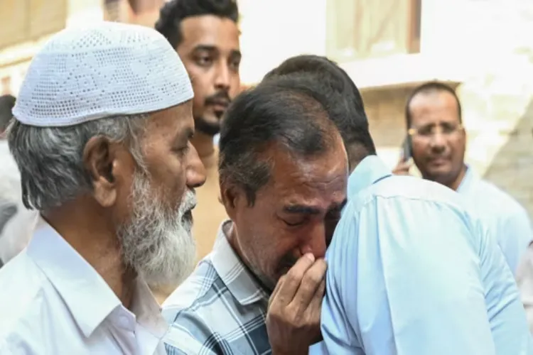 Grieving relatives of the victims of bus fire tragedy 