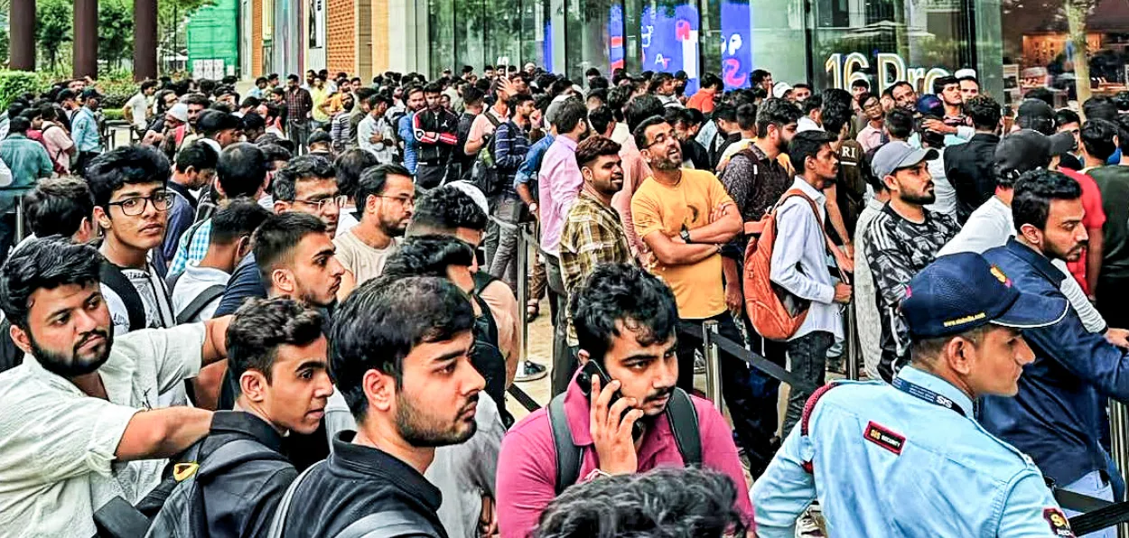 Youth queueing up for opening of Apple store in Mumbai to grab the latest version of Iphone on the day of its launch