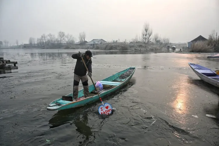 A boatman breaking frozen top of the lake to wade through