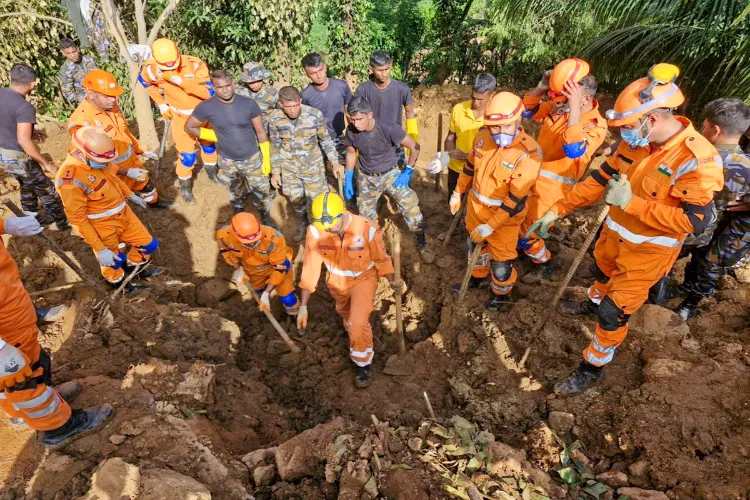 National Disaster Response Force (NDRF) team during the ongoing search operations, in Badulla, Sri Lanka. 