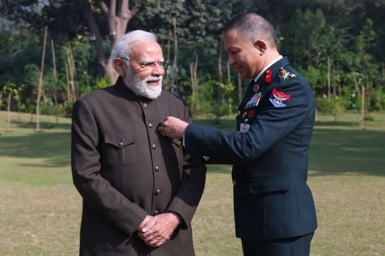 An Army Officer pinning a flag on Prime Minister Narendra Modi on Armed Forces Day