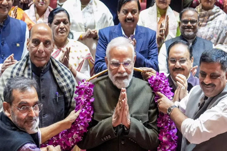 Prime Minister Narendra Modi being felicitated by MPs for the alliance' victory in Bihar Assembly elections during the NDA Parliamentary Party meeting, at Parliament premises in New Delhi
