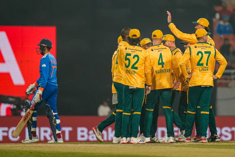 South Africa's players celebrate the wicket of India's Shubman Gill during the second T20 International cricket match of a series between India and South Africa, at Maharaja Yadavindra Singh International Cricket Stadium, in New Chandigarh