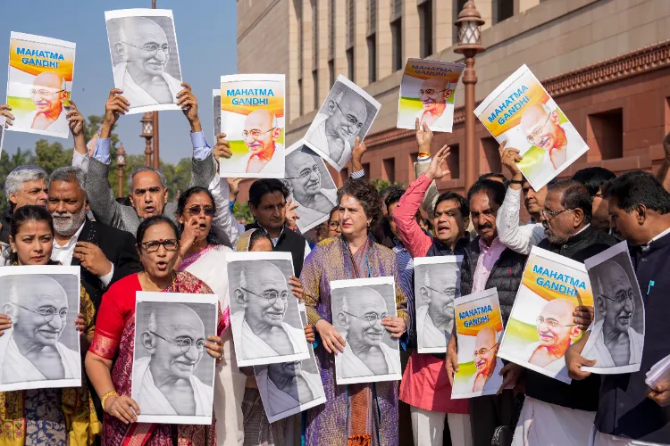Opposition MPs participate in a protest march against the VB-G RAM G Bill, introduced by the union government to replace the Mahatma Gandhi National Rural Employment Guarantee Act (MGNREGA), during the Winter session of Parliament, in New Delhi