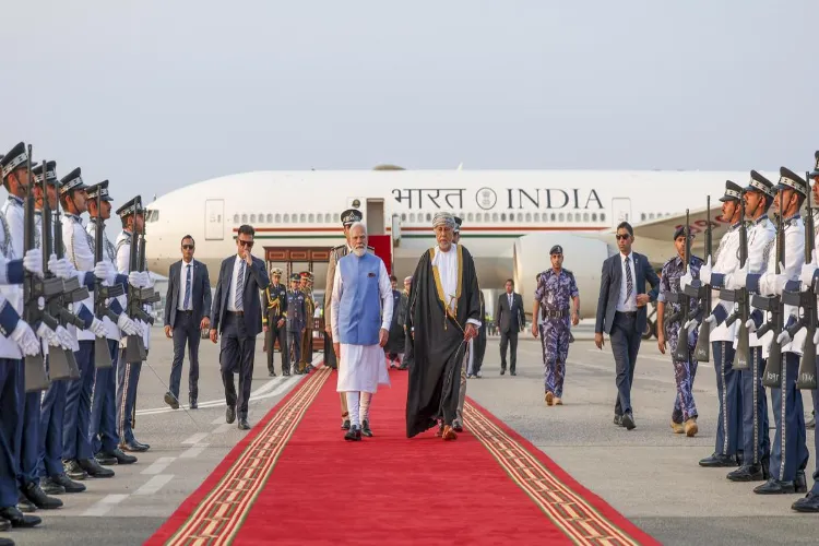 Prime Minister Narendra Modi with Oman Deputy Prime Minister for Defence Affairs Sayyid Shihab bin Tariq Al Said, right, as he arrives, in Muscat, Oman