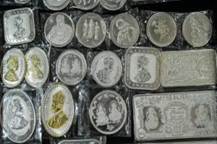 Silver coins and other items made of precious metal are displayed at a jewellery shop on the occasion of the Dhanteras festival, in New Delhi