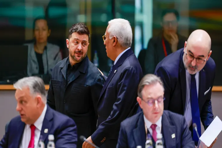 Ukraine's President Volodymyr Zelenskyy, second left, speaks with European Council President Antonio Costa, center rear, during a round table meeting at the EU Summit in Brussels