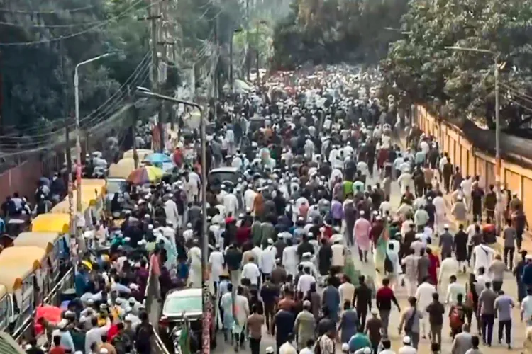 People gather in large numbers for the funeral of prominent youth leader Sharif Osman Hadi following unrest in Bangladesh triggered by his death, at the South Plaza of the National Parliament Building, in Dhaka