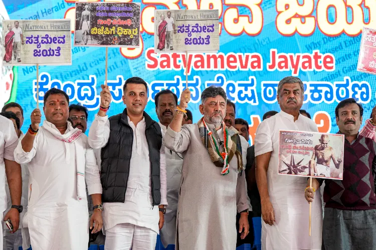  Karnataka Deputy Chief Minister and state Congress President D K Shivakumar, centre, with party leaders during a protest against the central government replacing the MGNREGA 