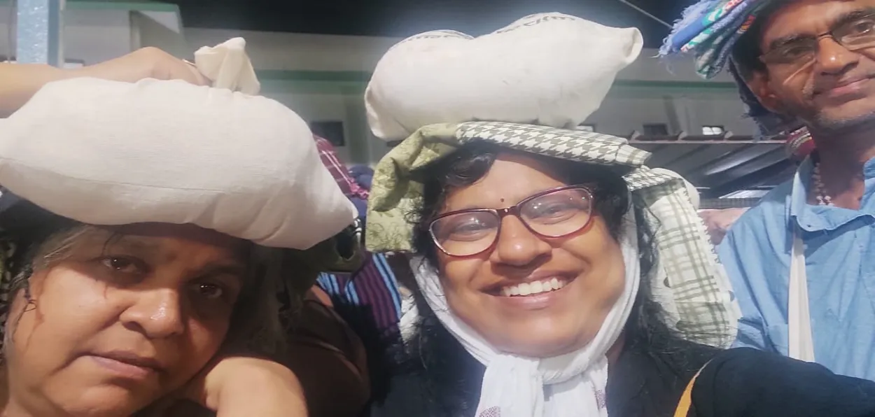 The author (Left) with her sister and brother-in-law carrying Irumudi Kettu on their heads on way to Sabrimala Temple in Kerala