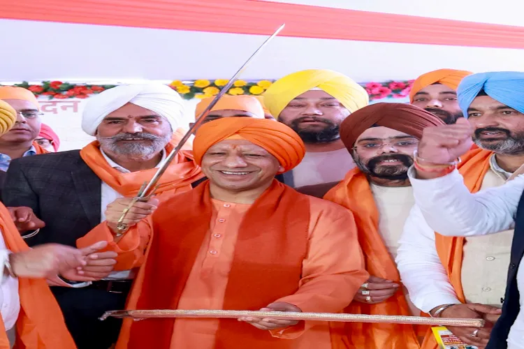 Uttar Pradesh Chief Minister Yogi Adityanath holds a sword at a 'Kirtan Samagam' on 'Veer Bal Diwas', observed to mark the martyrdom anniversary of the sons of tenth Sikh Guru, Guru Gobind Singh, in Lucknow