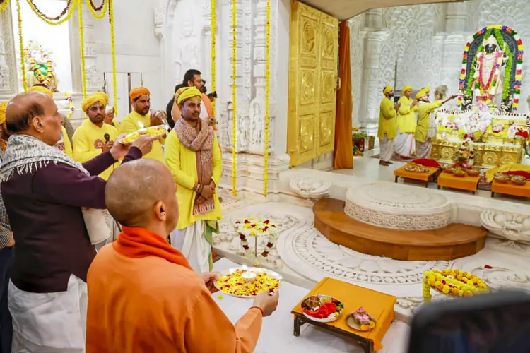 Defence Minister Rajnath Singh with Uttar Pradesh CM Yogi Adityanath offers prayers during the 'Pran Pratishtha Dwadashi', commemorating the second anniversary of the consecration of Ram Lalla's idol, in Ayodhya