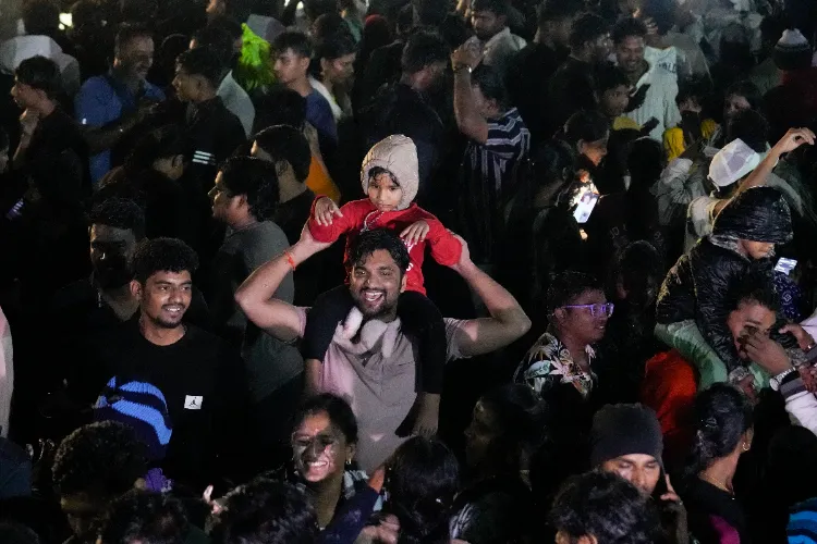 People celebrate on the occasion of New Year 2026, at Marina Beach in Chennai