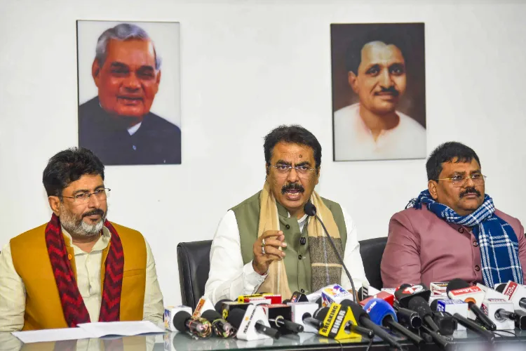 Bihar BJP President Sanjay Saraogi, centre, addresses a press conference, in Patna