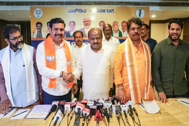 Union Minister HD Kumaraswamy, center, LoP in Karnataka Legislative Assembly R Ashoka, right, and BJP State President BY Vijayendra during a press conference, in Bengaluru