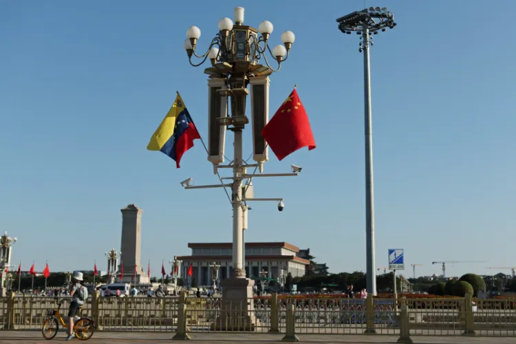 Flags of Venezuela and China flutter over Tiananmen Square