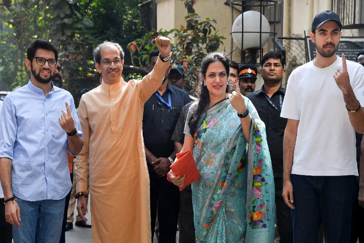 Shiv Sena (UBT) chief Uddhav Thackeray with wife Rashmi Thackeray and sons Aaditya Thackeray and Tejas Thackeray after casting his vote at a polling station during the Brihanmumbai Municipal Corporation (BMC) elections, in Mumbai, Maharashtra