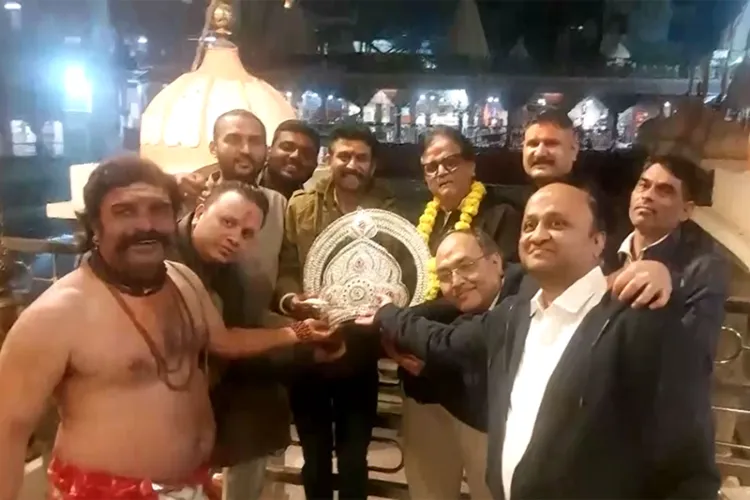 Devotee Pradeep Gupta and his team with silver crown