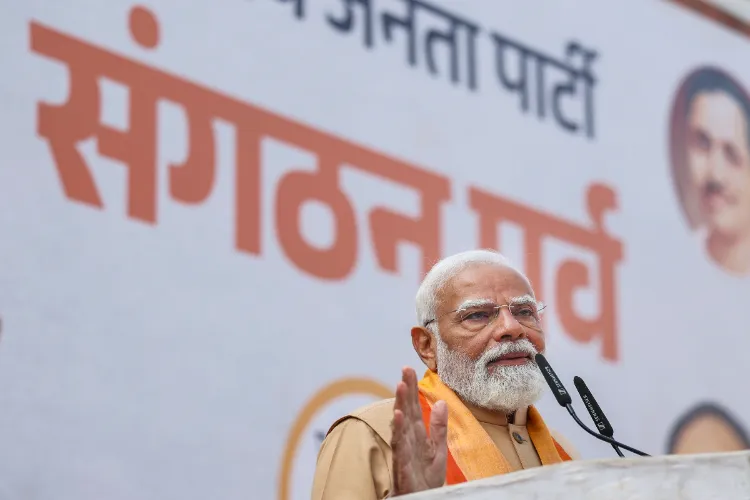 Prime Minister Narendra Modi addresses a gathering during the charge-taking of Nitin Nabin as the new BJP National President, at party headquarters, in New Delhi