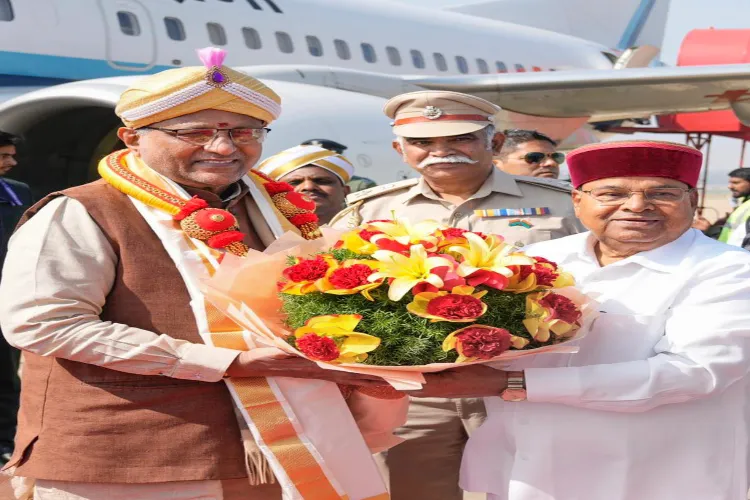 Vice President CP Radhakrishnan, left, being welcomed by Karnataka Governor Thawar Chand Gehlot at HAL Airport, in Bengaluru, Karnataka