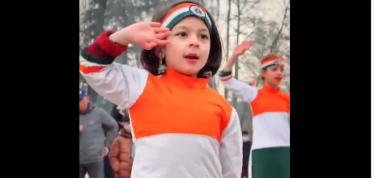 A Kashmiri schoolgirl singing and dancing on a parotitic number on Republic Day celebration