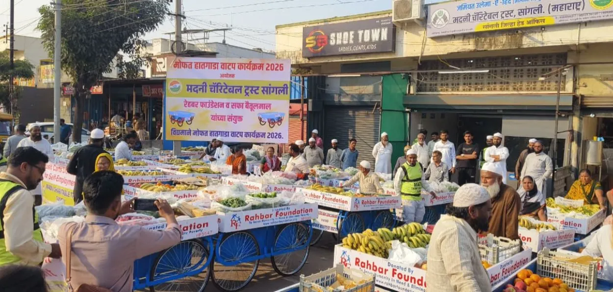 Carts laden with fruits being given to vendors