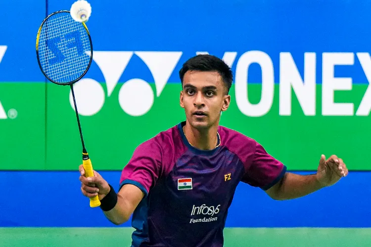 India's Kiran George returns a shot during a men�s singles match against Hong Kong's Jason Gunawan at the Syed Modi India International 2025, in Lucknow, Uttar Pradesh