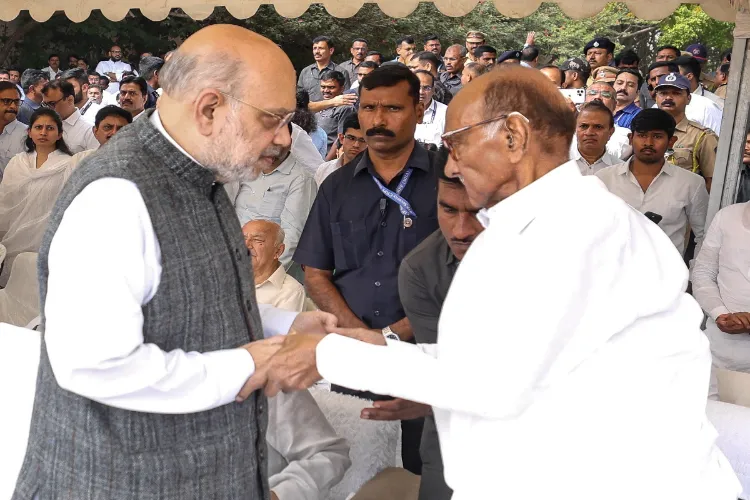 Union Home Minister Amit Shah meets NCP (SP) chief Sharad Pawar during the funeral of Maharashtra Deputy Chief Minister Ajit Pawar at the Vidya Pratishthan ground, in Baramati, Pune district