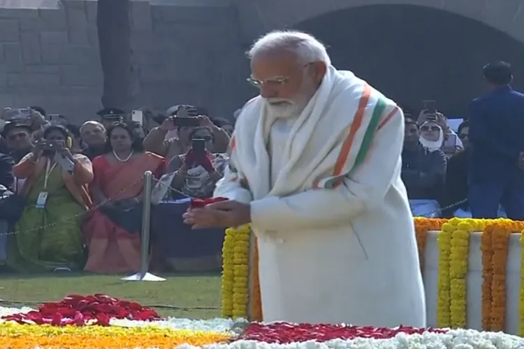 Prime Minister Narendra Modi pays tribute to Mahatma Gandhi at Rajghat