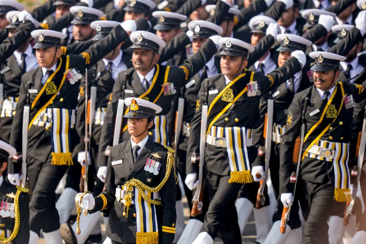 The Indian Coast Guard (ICG) contingent marches during the 77th Republic Day Parade at Kartavya Path, in New Delhi