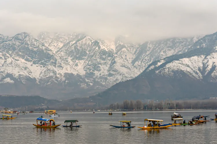 Dal Lake amid snow-covered mountains