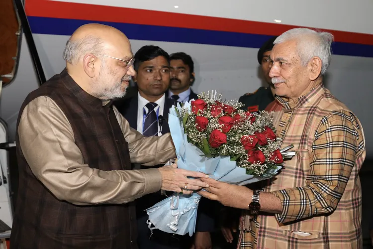 Union Home Minister Amit Shah being received by Jammu and Kashmir Lt. Governor Manoj Sinha and Chief Minister Omar Abdullah upon his arrival, in Jammu.